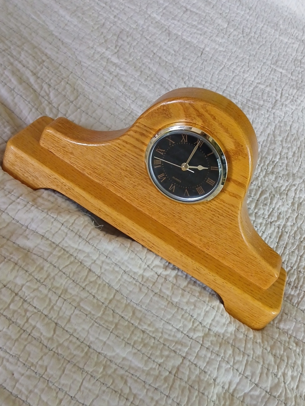 Napoleon-style oak quartz mantel clock